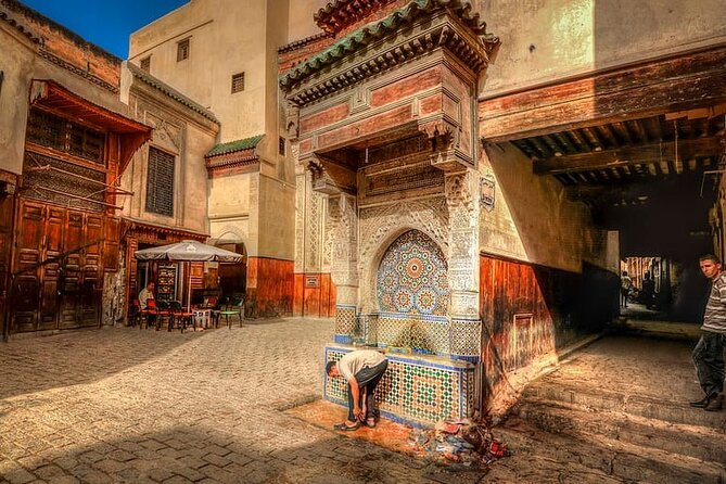 Fez Guided Tour of Artisans and Handicrafts Full-Day Private Tour - Bou Inania Madrasa and the first look at Fez architecture
