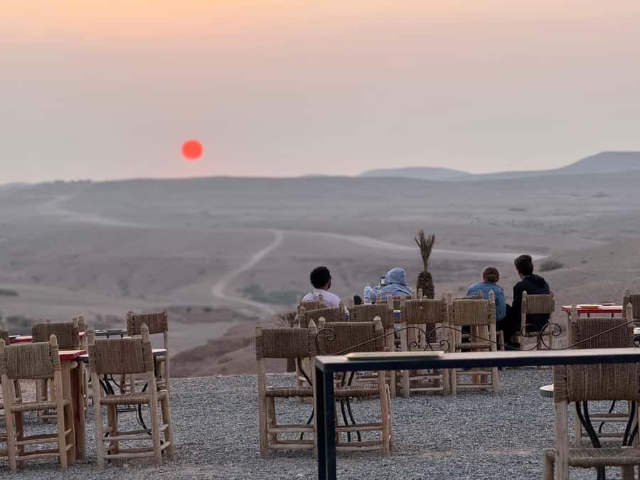 From Marrakech: Agafay Sunset Camel Tour with Dinner & Show - Transport, guides, and group arrangements