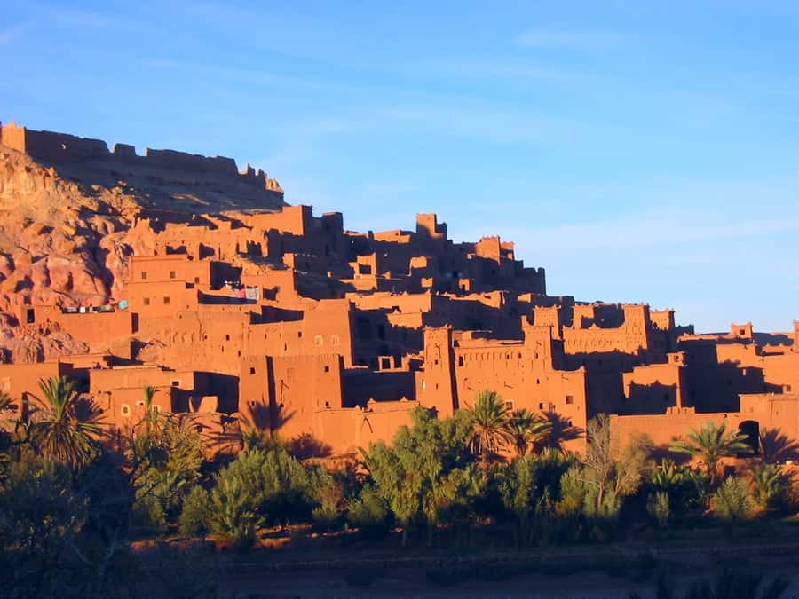 From Marrakech: Ait Benhaddou and Atlas Mountains Day Trip - Reaching the mud-brick walls of Ait Benhaddou