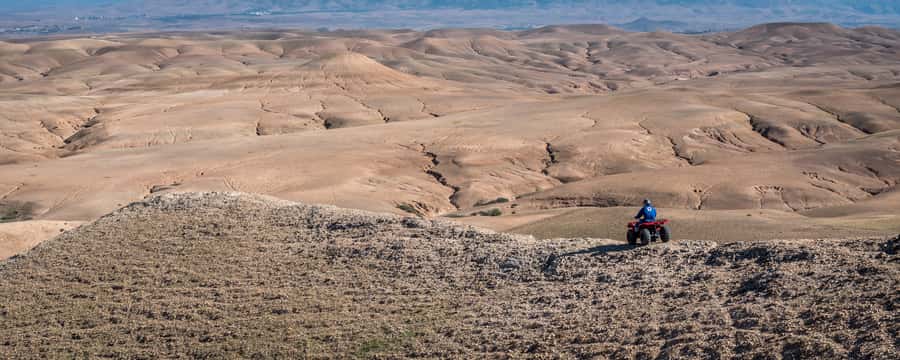 From Marrakech: Full-Day Agafay Desert Quad Adventure - Riding through canyons, dry hills, and oasis country