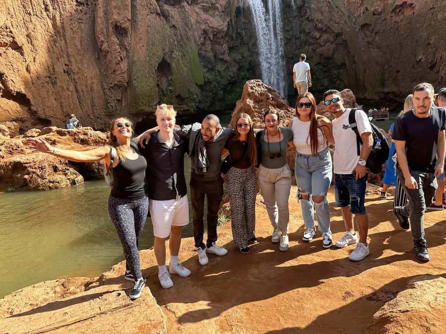 From Marrakech: Ouzoud Waterfalls guided trip with boat ride - First views of the red cliffs and olive groves
