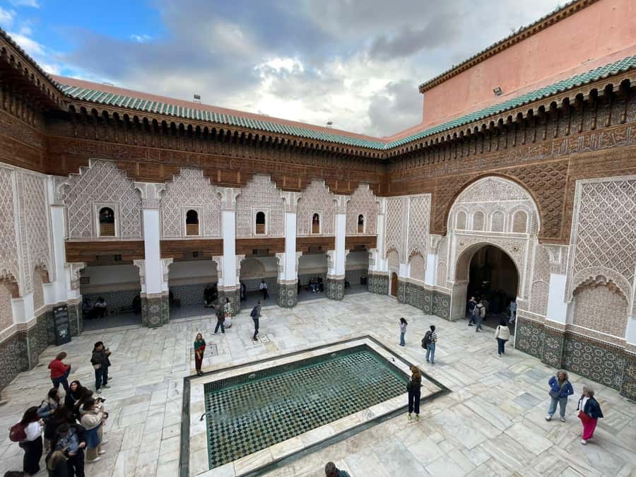 Marrakech: Ben Youssef Guided Tour with Skip-the-Line Entry - Walking from Jemaa el-Fna into the souks