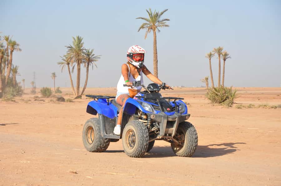Marrakech: Desert and Palm Grove Quad Tour with Tea - Riding through palms and rocky desert