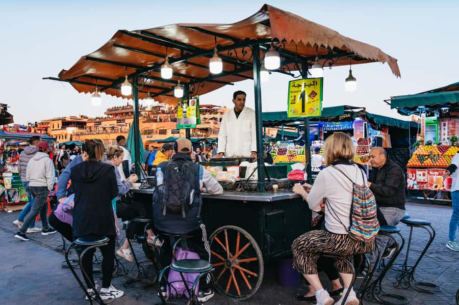 Marrakech: Medina by Night Walking Tour with Moroccan Tea - Through the souks and working lanes