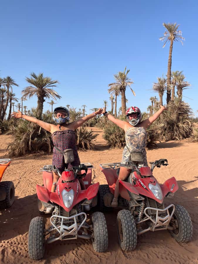 Marrakech: Palm Grove and Jbilat Desert Quad Bike Tour - Riding through palms, rocky ground, and village edges