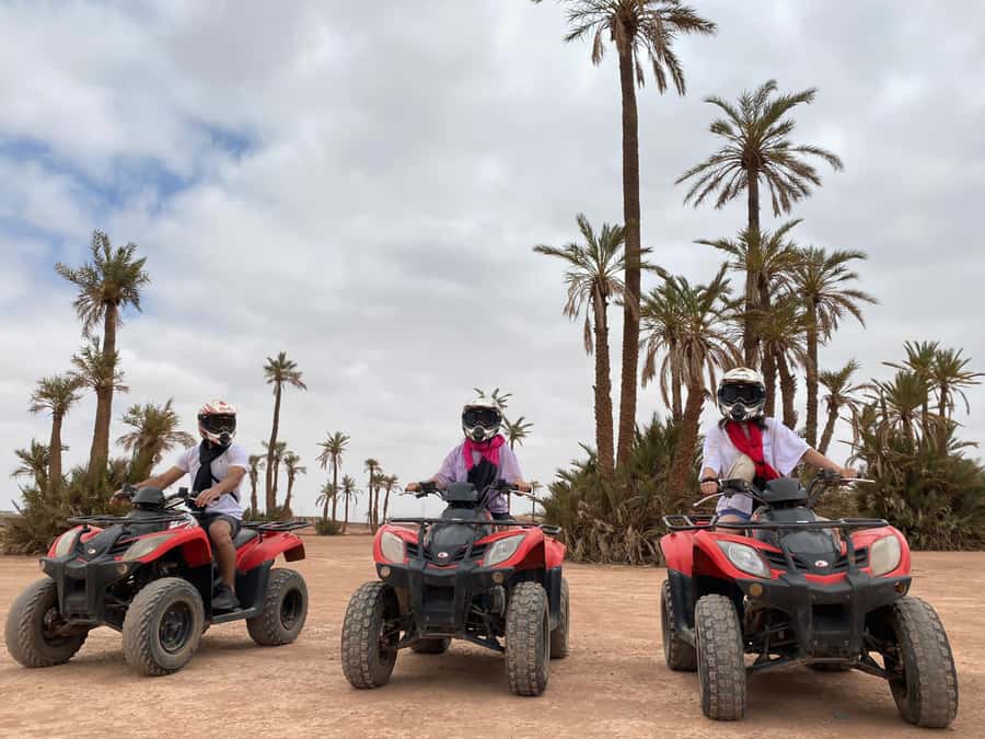 Marrakech: Quad Bike and Camel Ride Tour - Riding the quads through palm groves