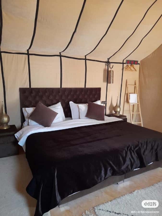 Merzouga: Overnight Stay in Luxury Desert Tent with Dinner - A sunset camel ride into Erg Chebbi