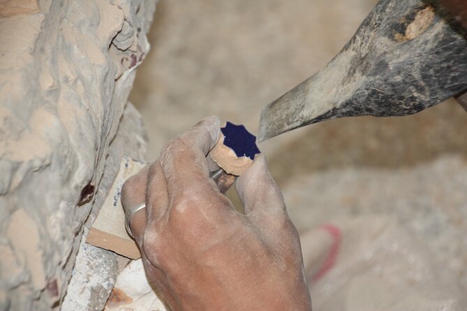 Pottery and Mosaic Workshop in Fes Led by Local Artisans - Painting Moroccan patterns on a pottery piece