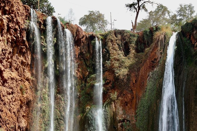 Small group Ouzoud Waterfall Guided Tour Boat Ride from Marrakech - The boat ride beneath the falling water